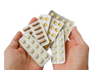 Lot of tablets pill in hands of the patient isolated on transparent