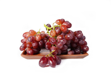bunch of red seedless grapes on a white background