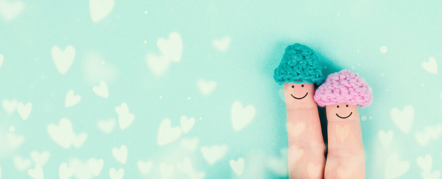Happy, similing face on finger, couple cuddle together, love, relationship and friendship concept, valentines day, bokeh hearts