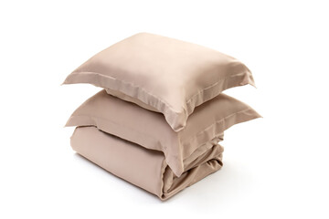 Two pillows in beige pillowcases and blanket on white background. Bed linen set