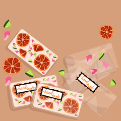 Decorative handmade white chocolate in a package. White chocolate with the addition of citrus, flowers for decoration and taste. Background for printing postcards, tags, banners.