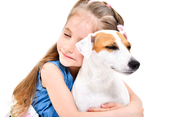 Tender portrait of little girl hugging jack russell terrier dog