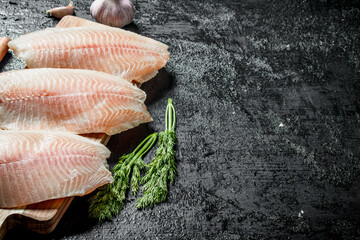 Tilapia fish fillet with dill.
