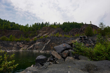 The blue lake in the shungite quarry has the healing power of rejuvenation, northern nature.