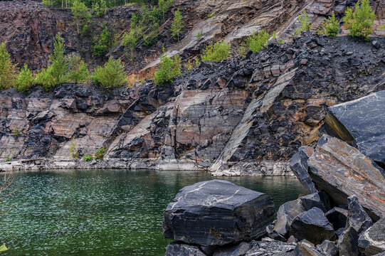 The blue lake in the shungite quarry has the healing power of rejuvenation, northern nature.