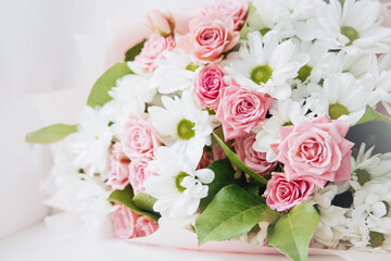 Background of beautiful bouquet of rose and chrysanthemums flowers. Backdrop for holiday, birthday, Wedding, Mother's Day, Valentine's day, Women's Day. Floral arrangement.