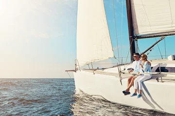 Fotobehang Relax, travel and luxury with couple on yacht for summer, love and sunset on Rome vacation trip. Adventure, journey and vip with man and woman sailing on boat for ocean, tropical and mockup at sea © Reese/peopleimages.com
