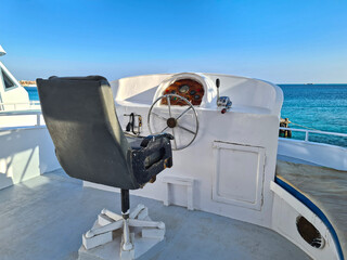 The place of the captain on a pleasure boat. Marine vehicle.