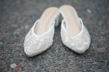 Obraz premium A Pair of Shoes for Bride in a Traditional Wedding Ceremony in Indonesia