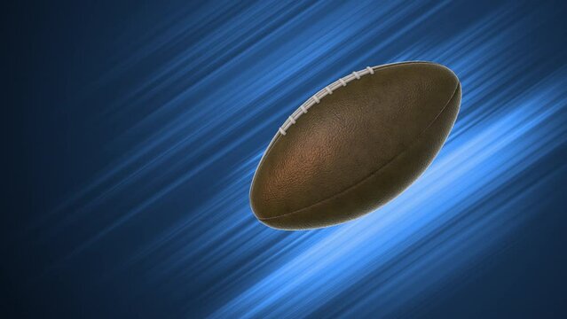 American football or rugby ball flying through the air