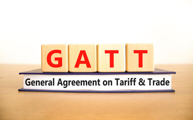 GATT symbol. Concept words GATT general agreement on tariff and trade on wooden block on beautiful white background. Business GATT general agreement on tariff and trade concept. Copy space.