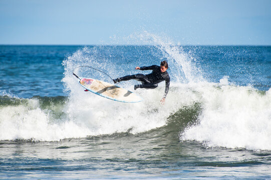 Man surfing hurricane surf, Point Judith, Narragansett, Rhode Island, USA