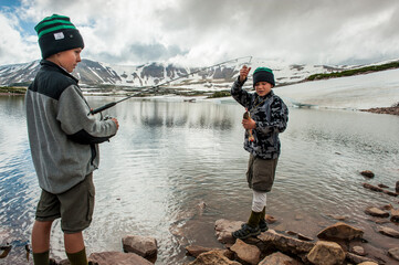 Boys fish in Superior Lake during a six day backpack trip through the High Uintas Wilderness Area, Uintas Range, Utah