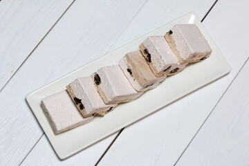 Homemade zephyr on a tray. On a white background. Close-up.