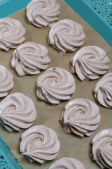 Homemade zephyr dry on a tray. On a white background. Close-up.