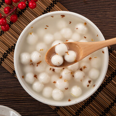 Little white tangyuan with sweet osmanthus honey and syrup soup.