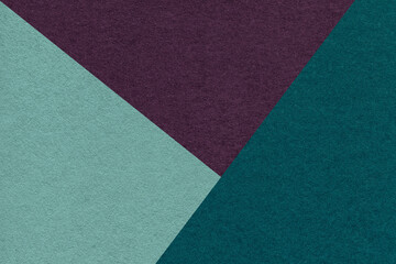Fototapeta premium Texture of craft cyan, emerald and purple shade color paper background, macro. Vintage abstract teal cardboard