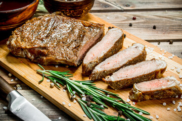 Grilled beef steak with spices and herbs.