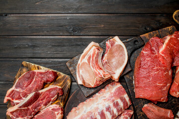Raw meat. Different kinds of pork and beef meat. - 562387265