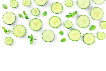 Fresh cucumber slices and mint leaves on a white background with copy space, overhead flat lay shot. Healthy organic food banner design