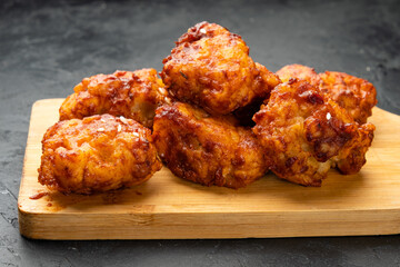Pieces of spicy chicken in Asian close-up. Chicken fillet in hot sauce.