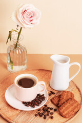 Coffee cup, cookies and jug with milk on a wooden tray. Morning breakfast concept
