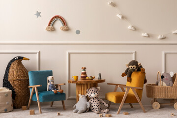Warm and cozy kids room interior with wooden table, velvet blue, orange armchair, wooden blockers,...