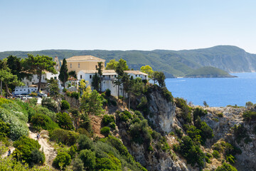 Fototapeta na wymiar Landscape of picturesque Paleokastritsa monastery in Corfu, Greece. Monastery of Holy Theotokos, 1225r