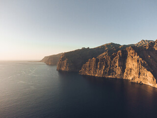Fototapeta na wymiar Aerial view of cliffs with ocean during sunset in Los Gigantes, Tenerife.