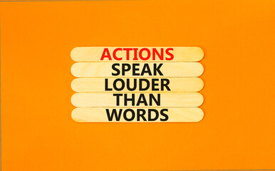 Actions speak louder words symbol. Concept words Actions speak louder than words on wooden stick. Beautiful orange table orange background. Business new mindset for results concept. Copy space.