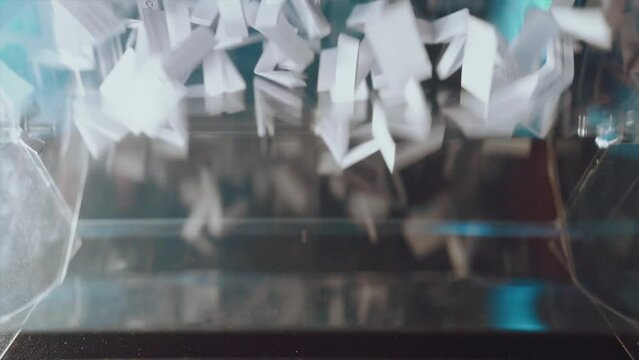 Lototron in slow motion, lototron rotation, lottery ticket shuffling in slow motion