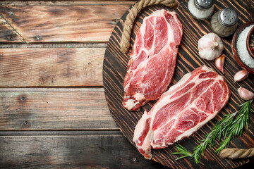 Raw steaks from juicy pork.