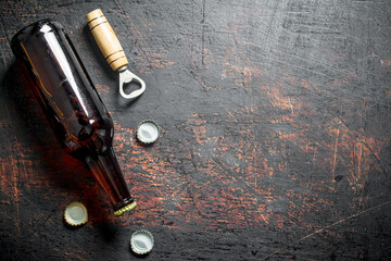 Glass beer bottle and opener.
