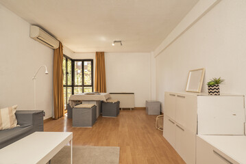 Dining room furnished with cardboard furniture and dining table of the same material