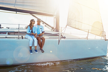 Yacht, relax and travel with a mature couple sitting on a boat out at sea for love, romance or...