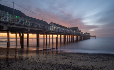 Southwold Pier on the Suffolk coast from the southside with a colourful sunrise sky sunrise