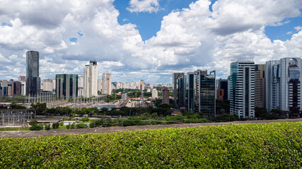 Fototapeta premium São Paulo, Brazil Skyline on a beautiful day with blue sky and fluffy clouds. Power station and modern buildings 