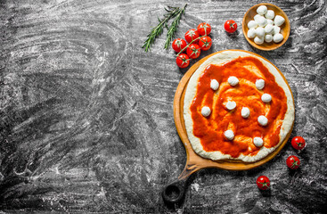 Preparation of fresh homemade pizza.