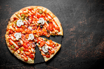 Slices of crispy pizza with tomatoes, peppers and mushrooms.