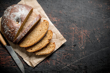 Sliced fresh bread with a knife.
