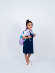 A malaysian girl on her primary school uniform with her backpack isolated on white background. 