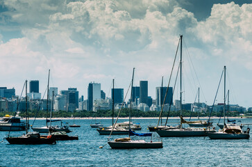 Fototapeta na wymiar Scenic View of boats on Guanabara bay in Rio de Janeiro with skyline in the background