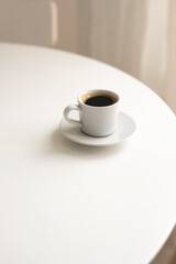 Cup of coffee on a table. Hot drink