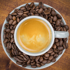 Espresso Coffee surrounded by beans macro