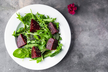 beet salad beetroot pieces mix green lettuce healthy meal food snack on the table copy space food background rustic top view keto or paleo diet veggie vegan or vegetarian food
