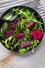 beet salad beetroot pieces mix green lettuce healthy meal food snack on the table copy space food...