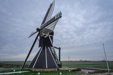 Obraz premium Mellemolen, dutch windmill in Akkrum, the Netherlands. In the winter with Some snow.