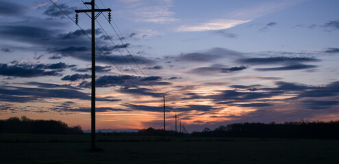 Sunset over industrial powerlines