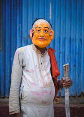Hindu religious village people celebrating gajan festival wearing colourful costumes 