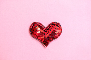 Red heart on pink paper. Valentine's Day postcard.